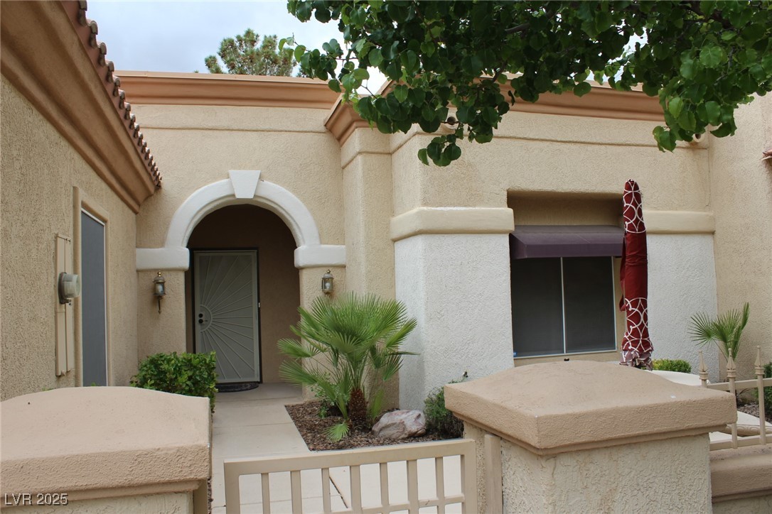 2013 Capestone Street Las Vegas, NV 89134 - Photo 3 of 40 Doorway to property with stucco siding