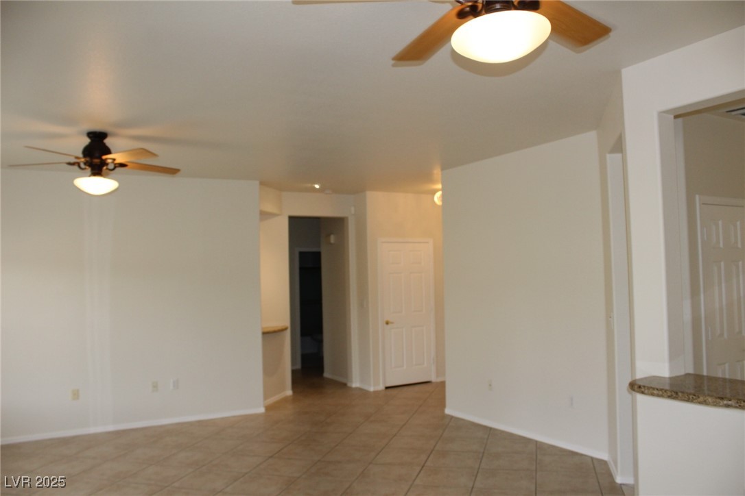 2013 Capestone Street Las Vegas, NV 89134 - Photo 6 of 40 Empty room with light tile patterned floors, baseb