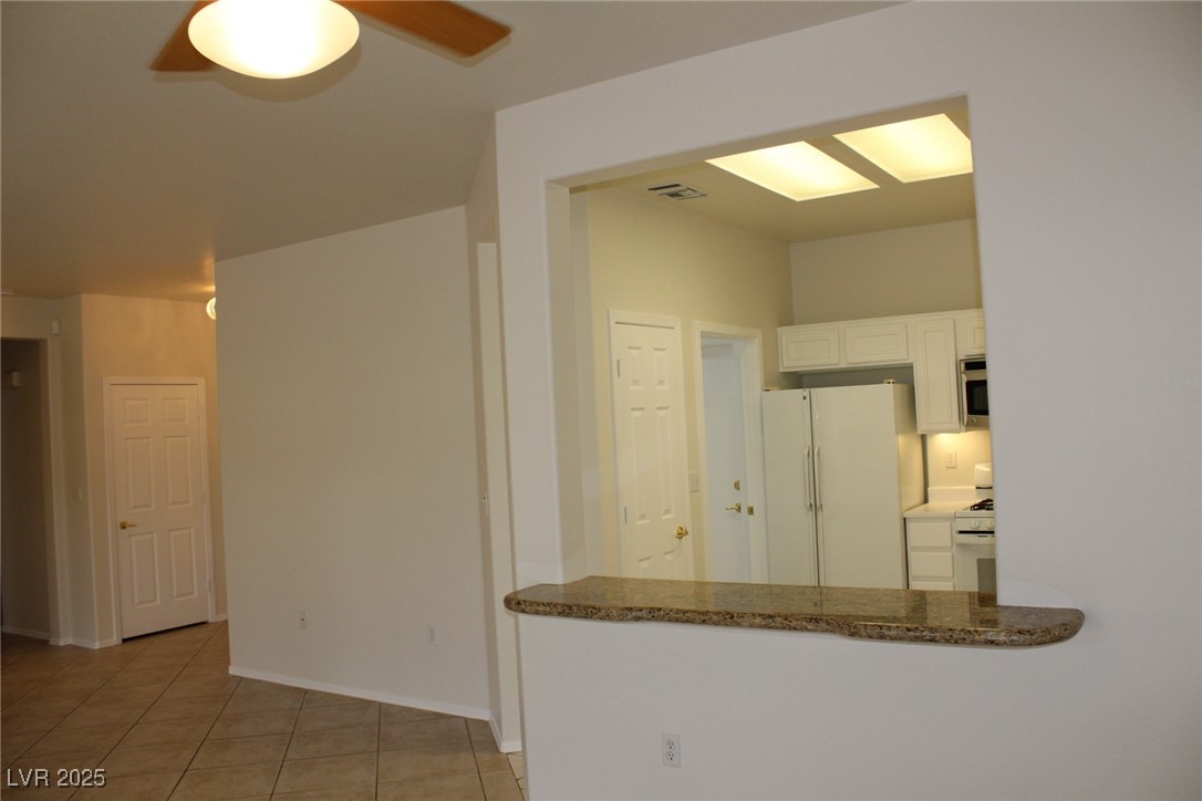 2013 Capestone Street Las Vegas, NV 89134 - Photo 8 of 40 Kitchen featuring light tile patterned floors, whi