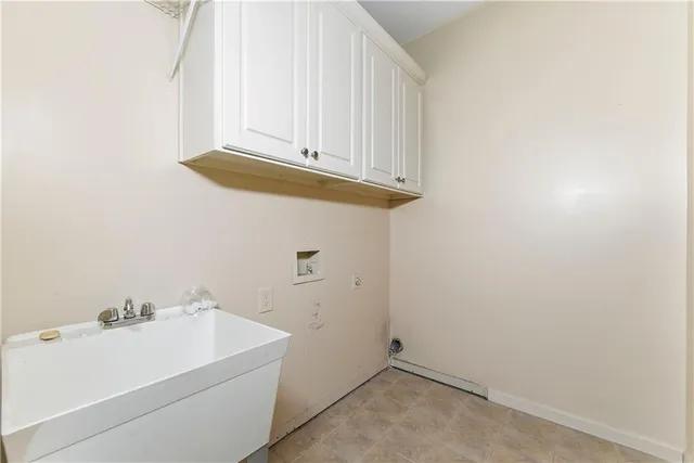 a view of a utility room with a sink