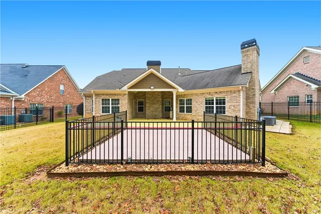 a front view of a house with a swimming pool