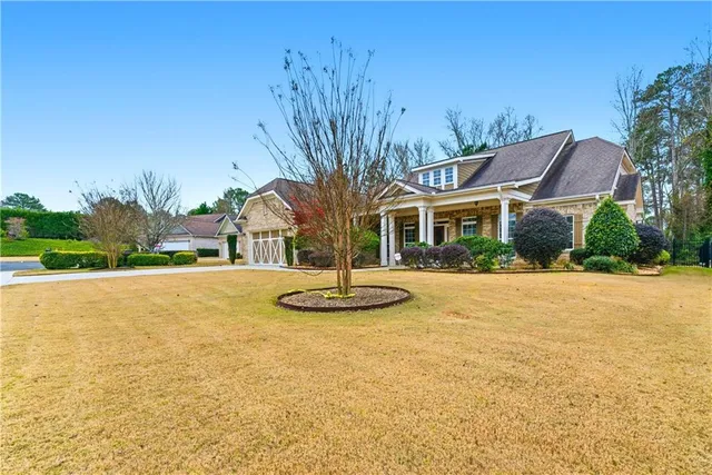 a view of a house with pool and yard