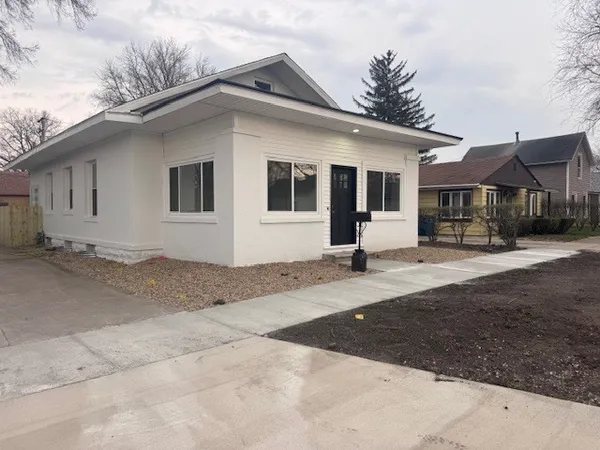 a living room with furniture a window and a table