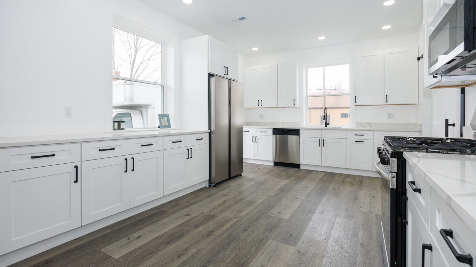 733 West Prairie Street Pontiac, IL 61764 - Photo 13 of 32 a kitchen with white cabinets sink and stainless steel appliances