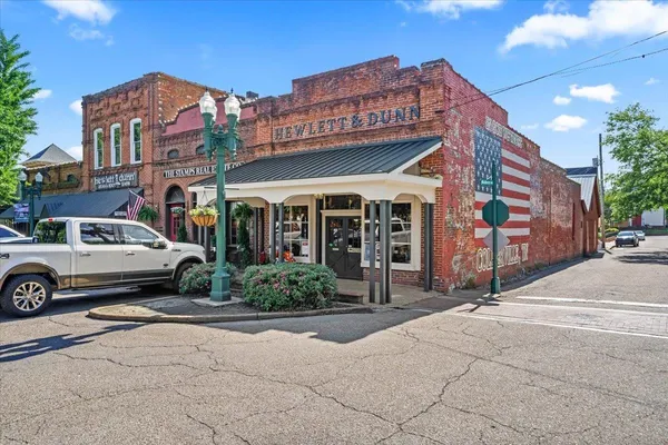 a front view of a building with garden