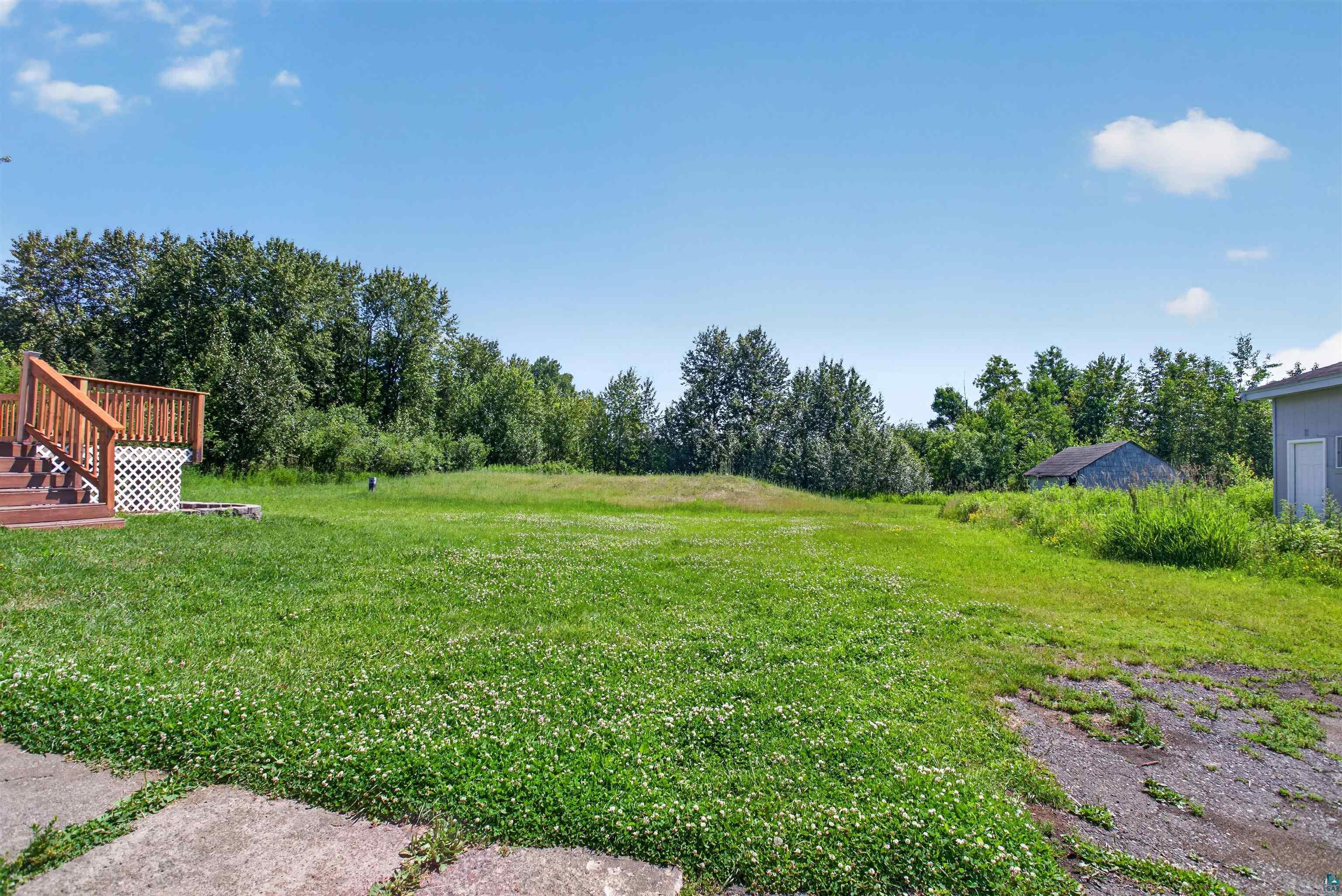 5868 Rice Lake Road Duluth, MN 55803 - Photo 4 of 39 Expansive grassy lot with mature perimeter trees