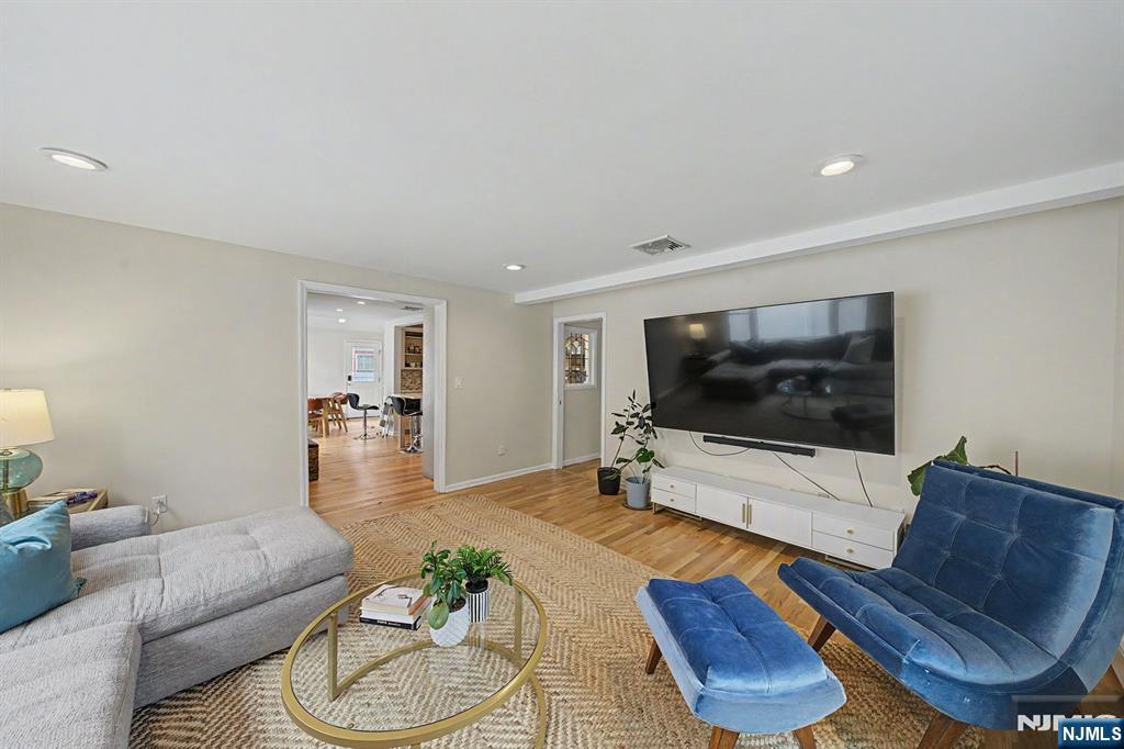 45 Highfield Road Bloomfield, NJ 07003 - Photo 15 of 50 a living room with furniture and a flat screen tv