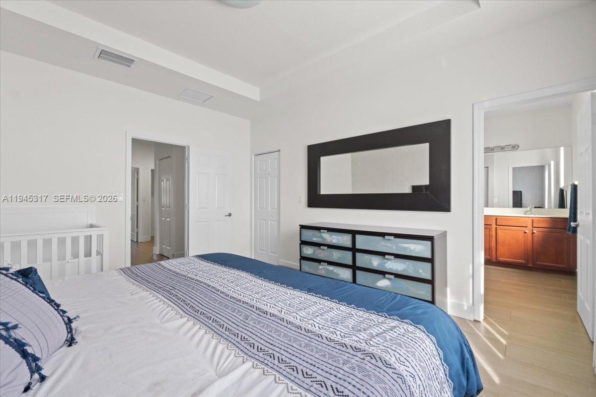 17619 Southwest 153rd Path Miami, FL 33187 - Photo 13 of 35 a bedroom with a bed and a view of kitchen