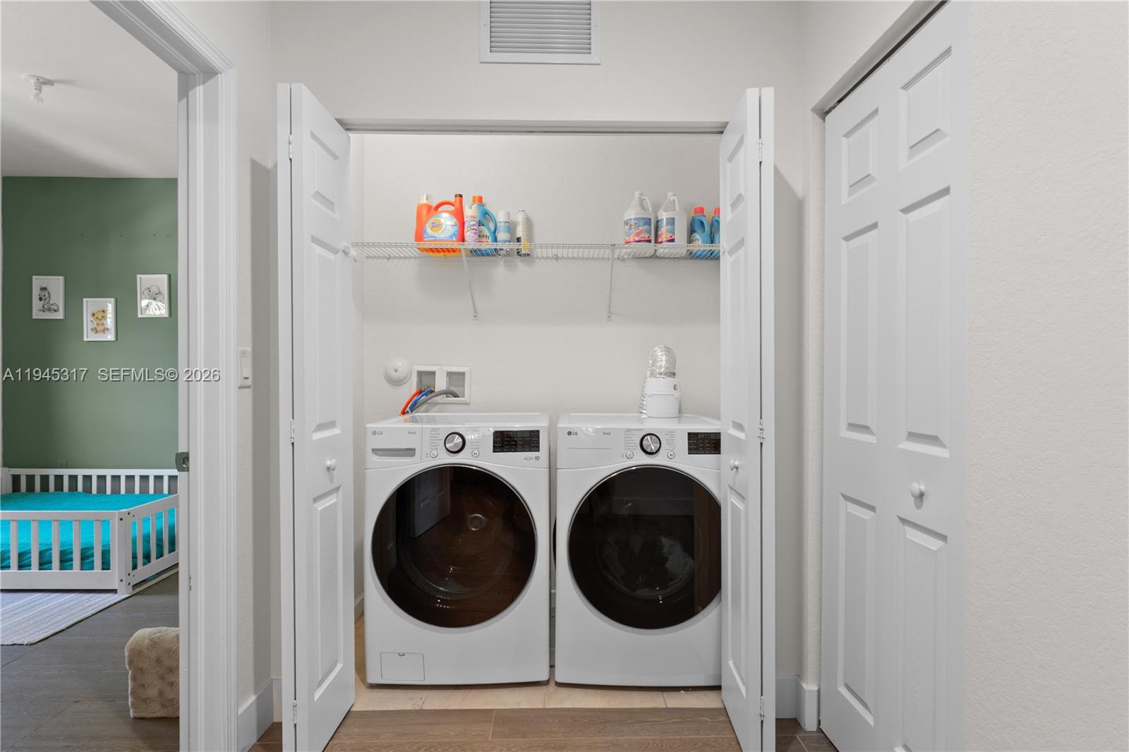 17619 Southwest 153rd Path Miami, FL 33187 - Photo 20 of 35 a view of storage and utility room with washer and dryer