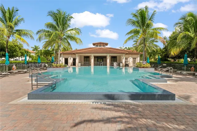 a front view of multiple houses with yard