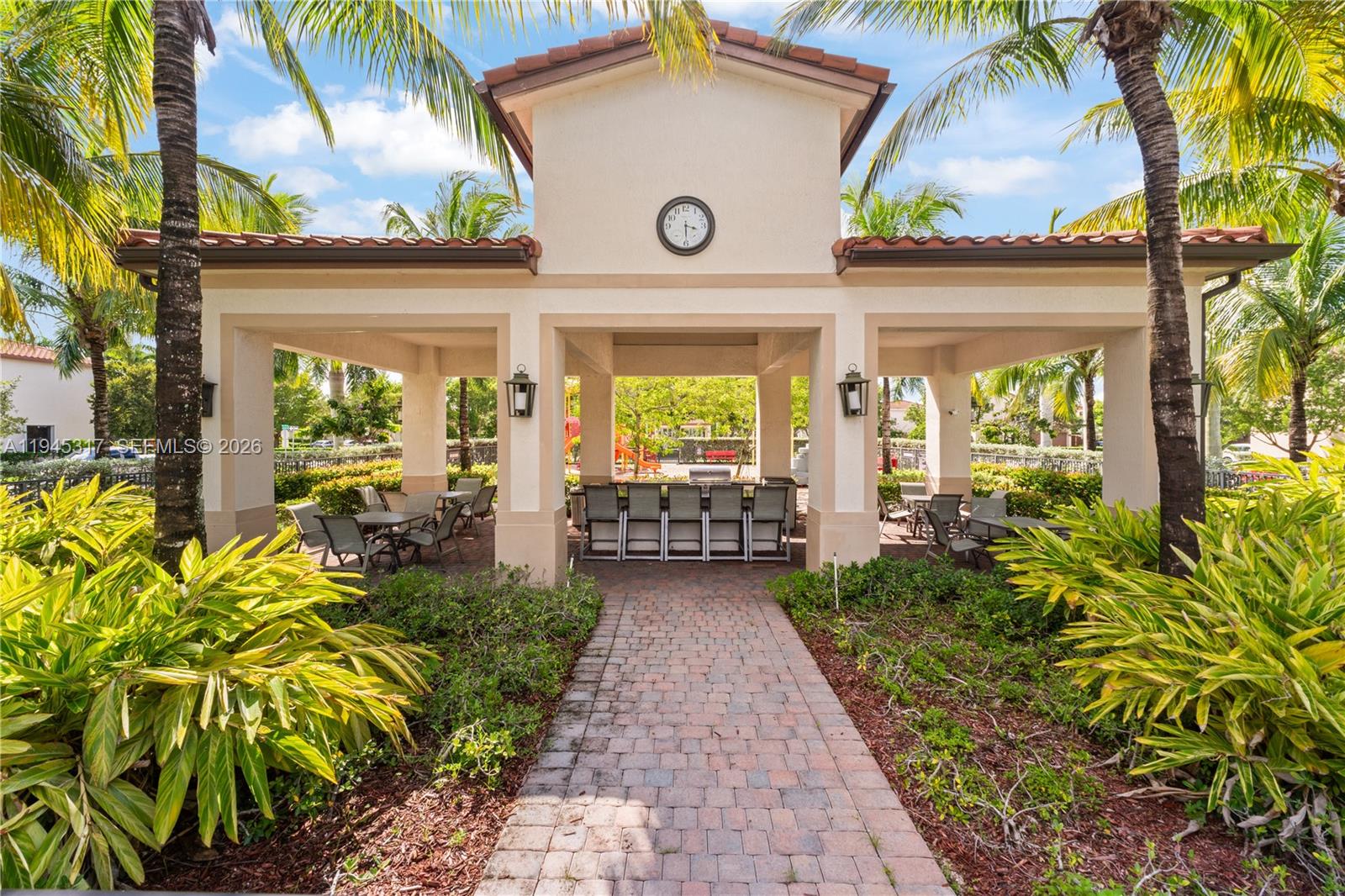 17619 Southwest 153rd Path Miami, FL 33187 - Photo 33 of 35 a view of a house with a flower garden
