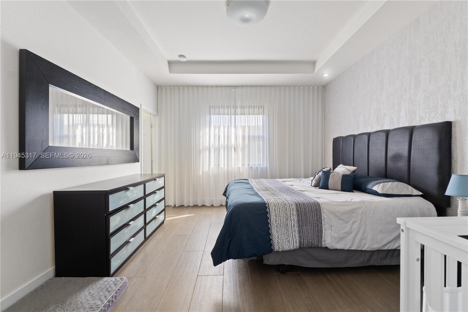 17619 Southwest 153rd Path Miami, FL 33187 - Photo 4 of 35 a bedroom with a bed and window