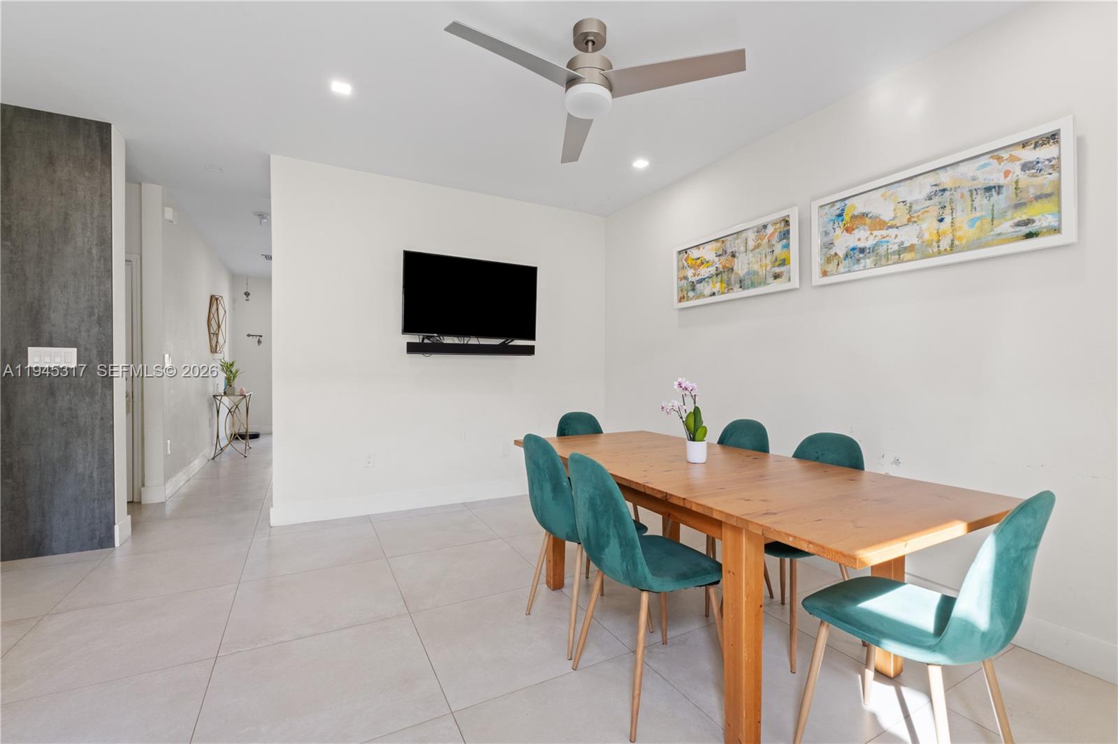 17619 Southwest 153rd Path Miami, FL 33187 - Photo 6 of 35 a view of a livingroom with furniture and a flat screen tv