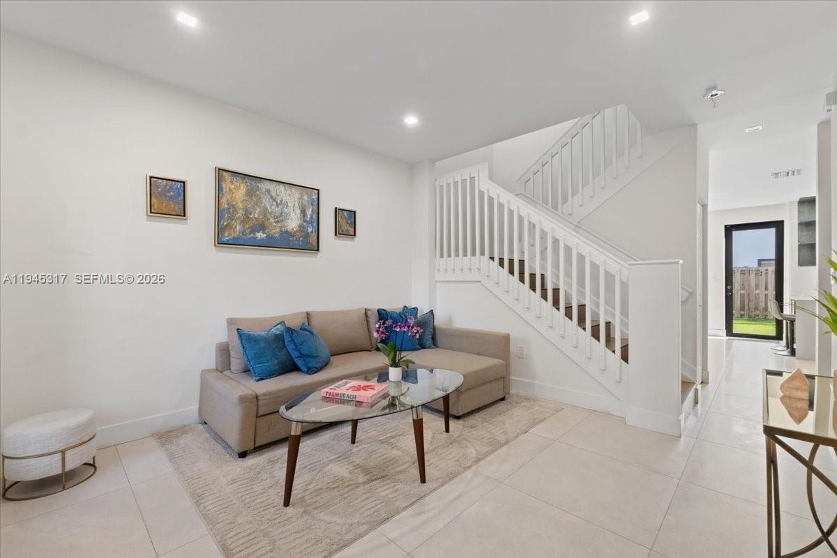 17619 Southwest 153rd Path Miami, FL 33187 - Photo 7 of 35 a living room with furniture and a wooden floor