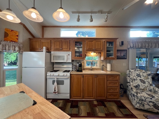 2795 East 28th Road Marseilles, IL 61341 - Photo 15 of 79 a kitchen with stainless steel appliances granite countertop a stove and a refrigerator