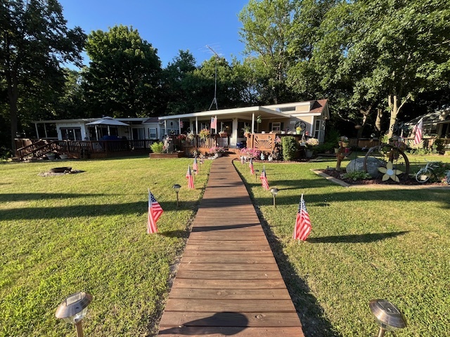 2795 East 28th Road Marseilles, IL 61341 - Photo 7 of 79 a view of house with a yard and potted plants