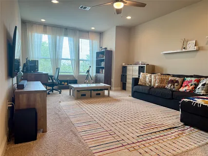 a living room with furniture and a couch