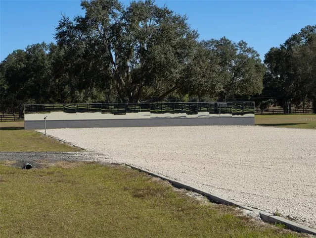 a view of swimming pool with a patio