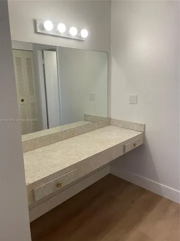 a bathroom with a tub and shower