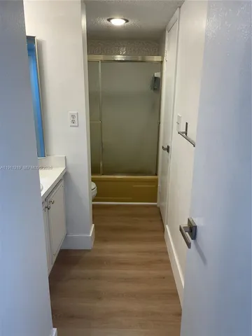 a view of a bathroom from the hallway