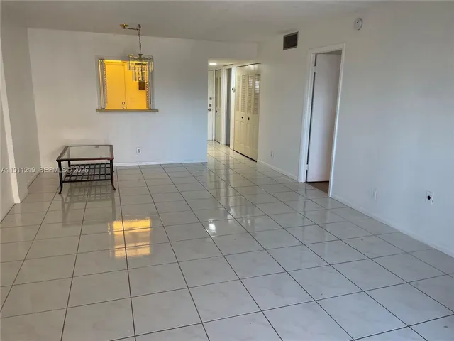 a view of a room with a large window