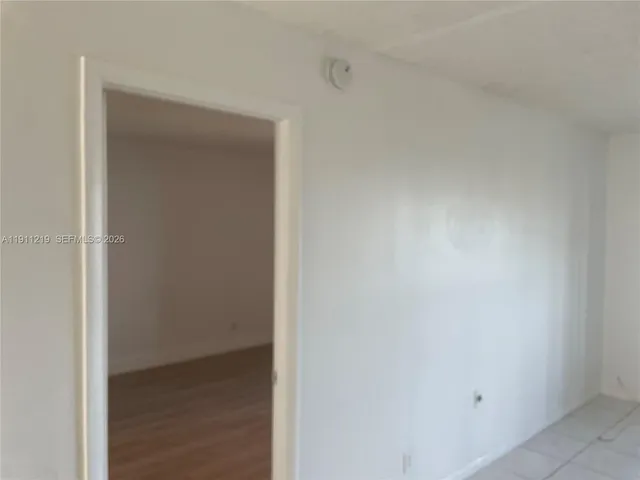 a kitchen with stainless steel appliances granite countertop a refrigerator and a stove