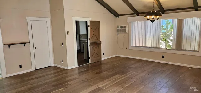 a bathroom with a sink and a stove with a toilet