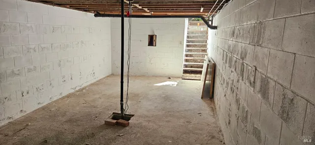 a vase of flowers sitting on a floor