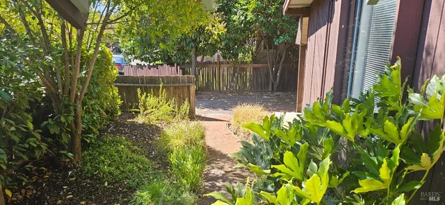 a view of a livingroom with wooden floor a fireplace