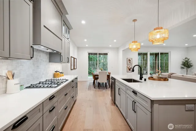 a kitchen with lots of counter space and wooden floor