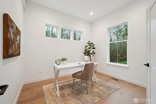 a workspace with furniture and window