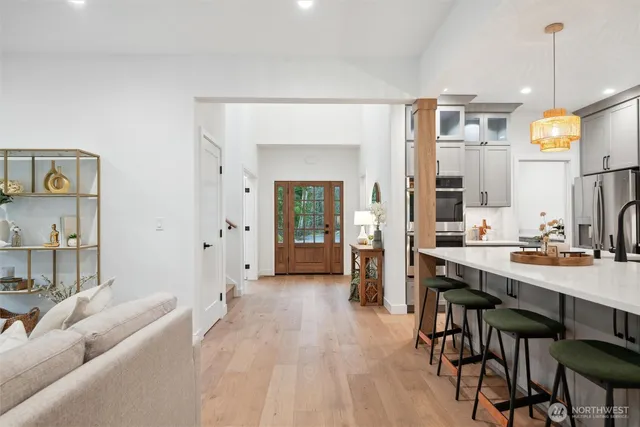 a living room with furniture a dining table and chairs