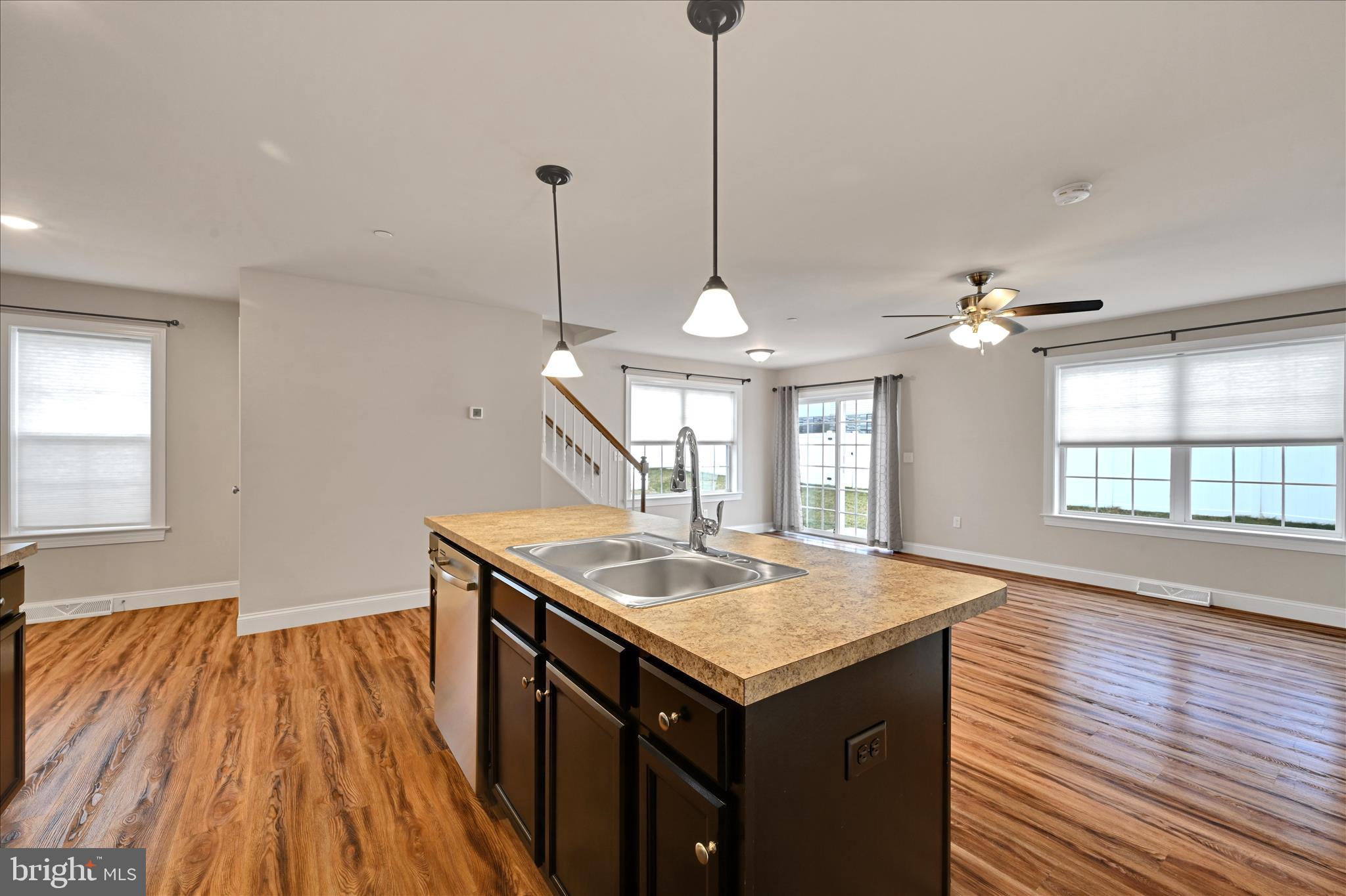 362 Cedar Hollow Manheim, PA 17545 - Photo 14 of 34 a kitchen with a sink chandelier and wooden floor