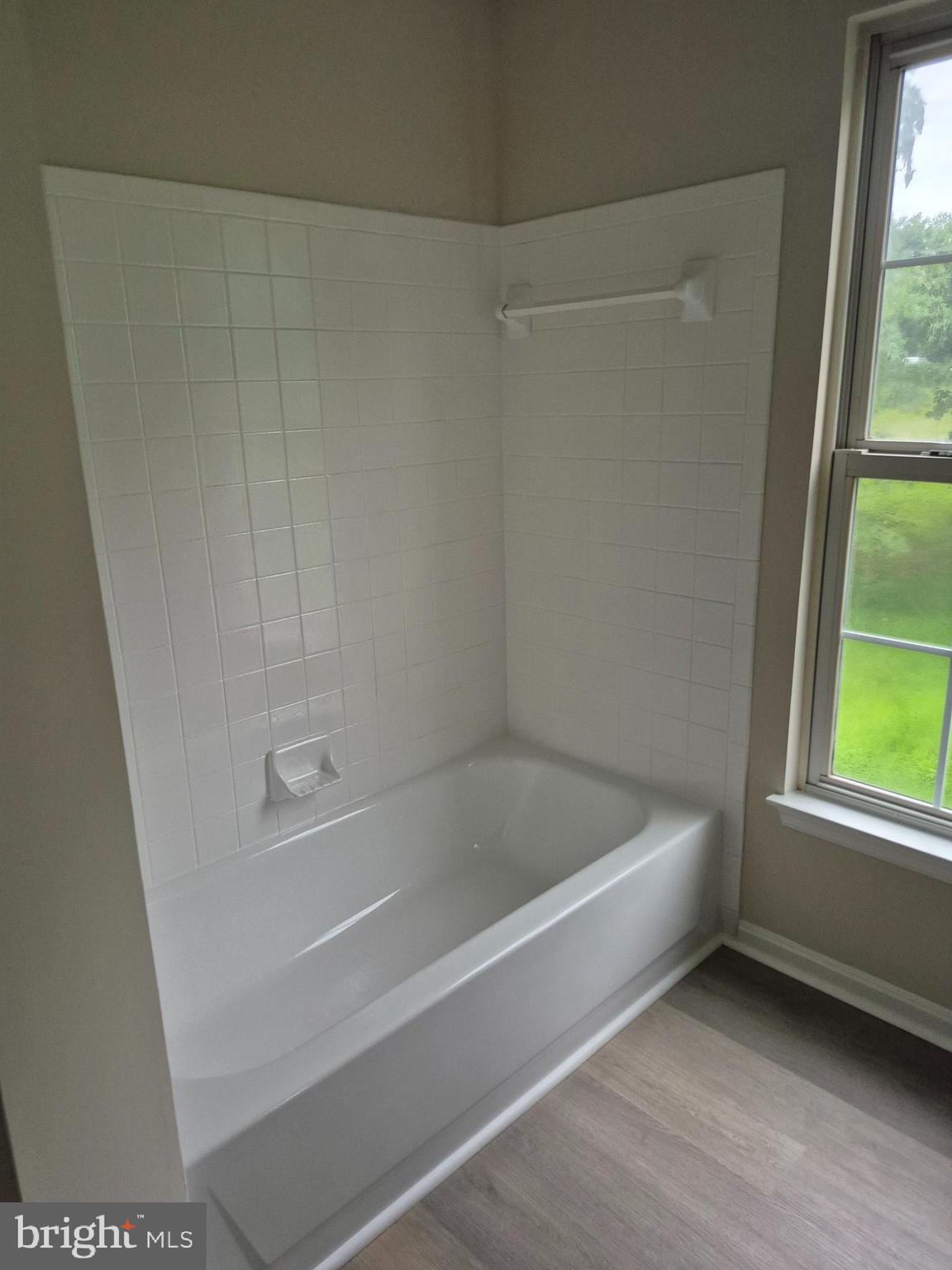 7006 Chain Fern Court Clinton, MD 20735 - Photo 13 of 23 a white bath tub sitting next to a window