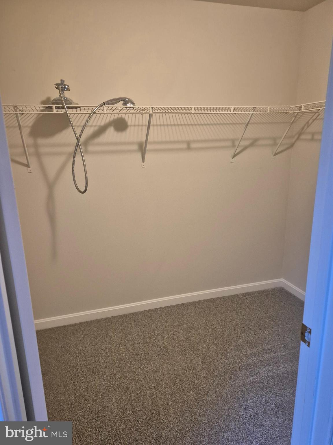 7006 Chain Fern Court Clinton, MD 20735 - Photo 14 of 23 a view of small space with racks on the wall