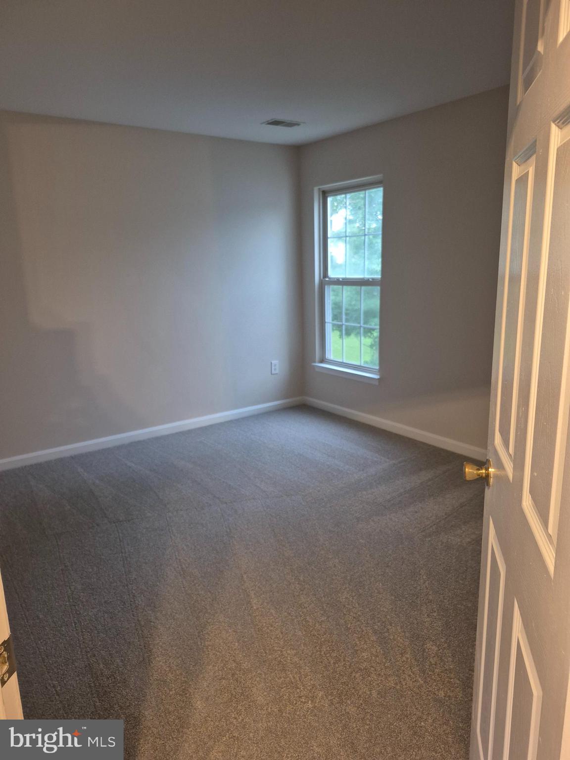 7006 Chain Fern Court Clinton, MD 20735 - Photo 17 of 23 an empty room with windows