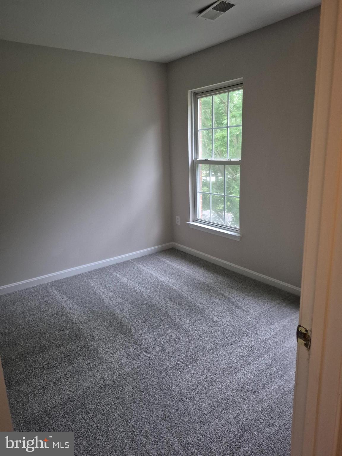 7006 Chain Fern Court Clinton, MD 20735 - Photo 18 of 23 a view of a window in an empty room