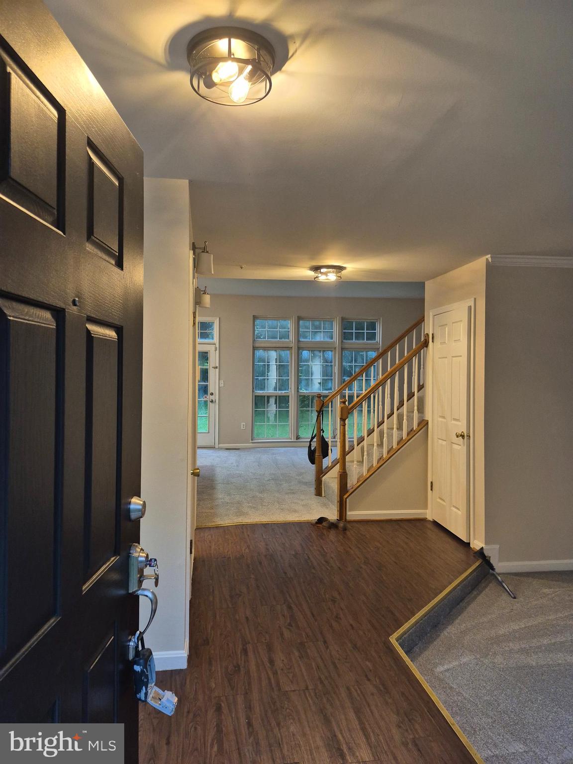 7006 Chain Fern Court Clinton, MD 20735 - Photo 2 of 23 an entryway in a hall with a window