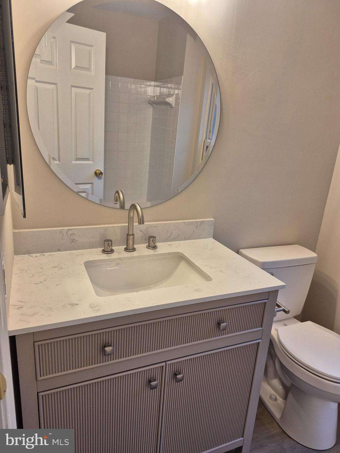7006 Chain Fern Court Clinton, MD 20735 - Photo 10 of 23 a bathroom with a sink and a mirror