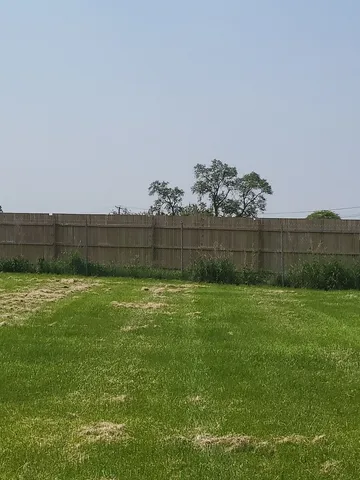a view of a backyard with green space