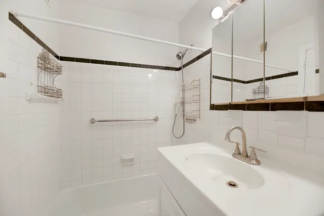 a bathroom with a sink and a shower