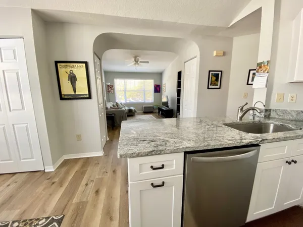 a kitchen with a sink and a refrigerator