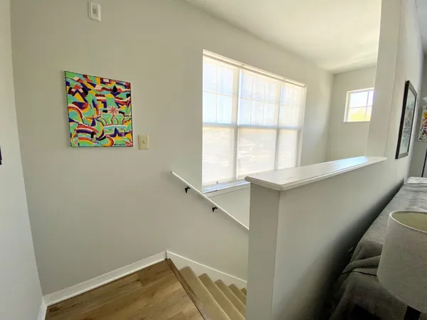 a view of room with window and hallway