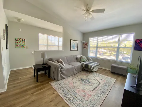 a living room with furniture and a window