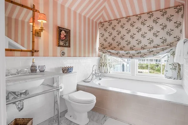 a bathroom with a sink a toilet and a bathtub