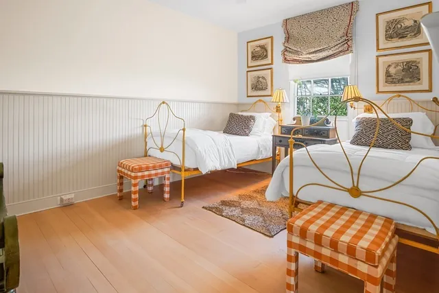 a living room with furniture and next to a window