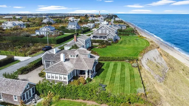 a aerial view of a house with a garden and lake view