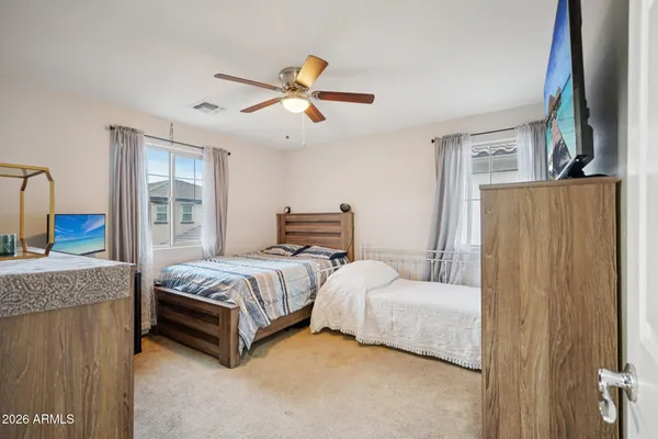 a bathroom with a sink and mirror with window