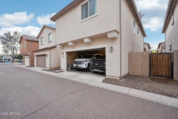 a bathroom with a double vanity sink mirror and shower