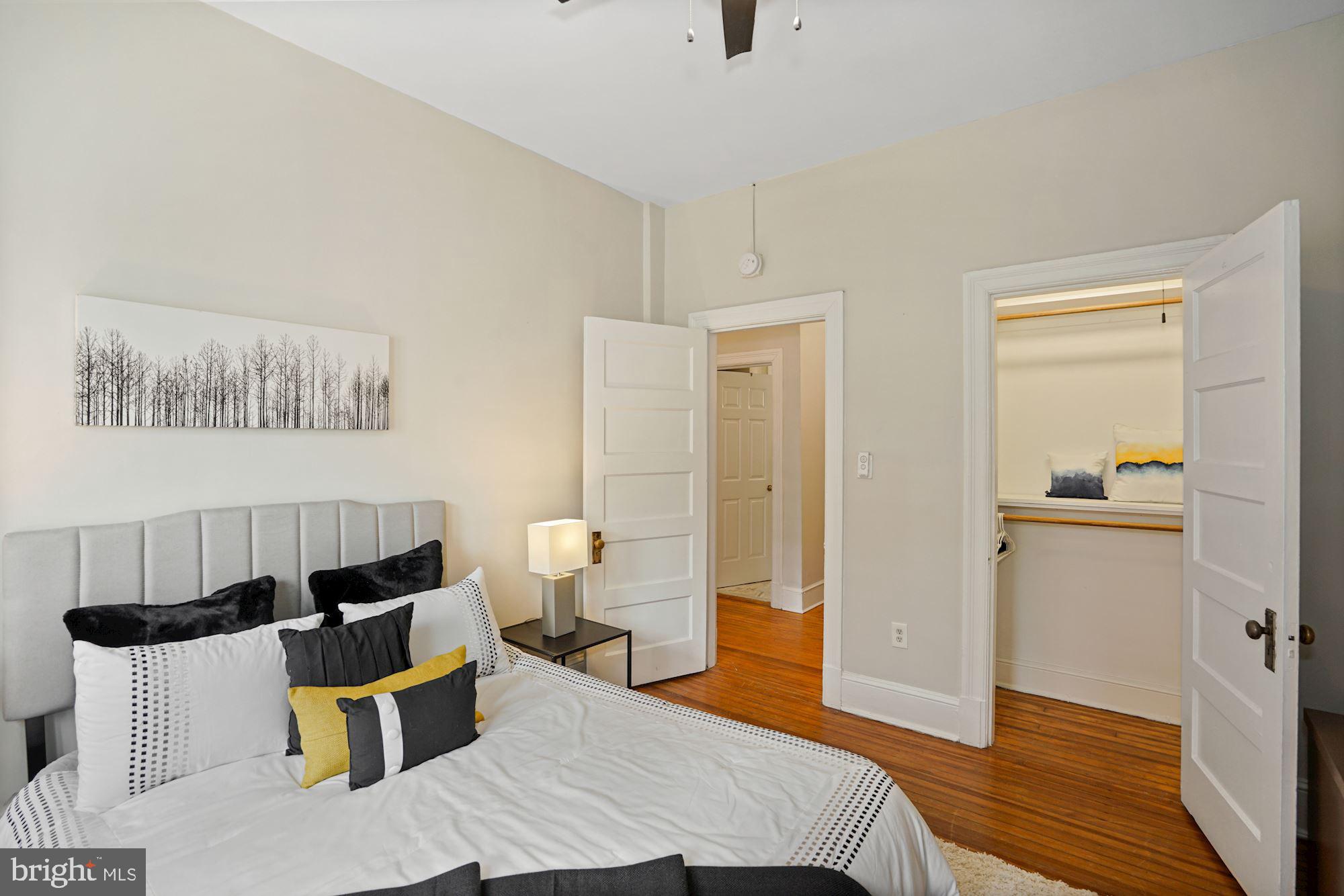 1322 15th Street Northwest, Unit 3 Washington, DC 20005 - Photo 11 of 16 a bedroom with a bed and wooden floor